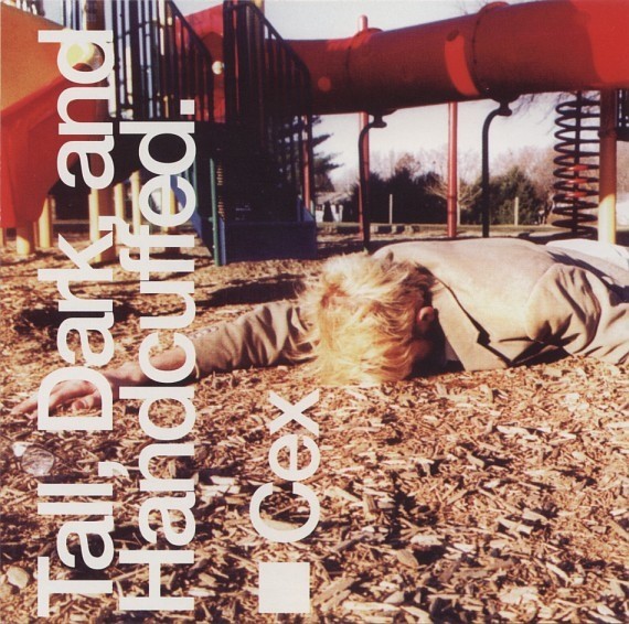 Tall, Dark, And Handcuffed. cover